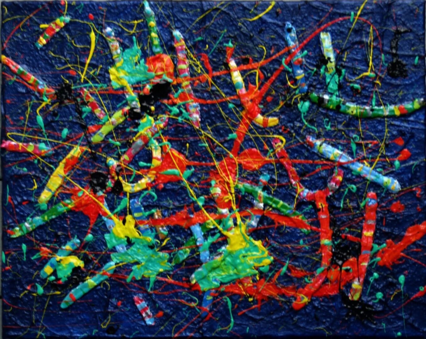 A painting of colorful sticks and paint on the ground.