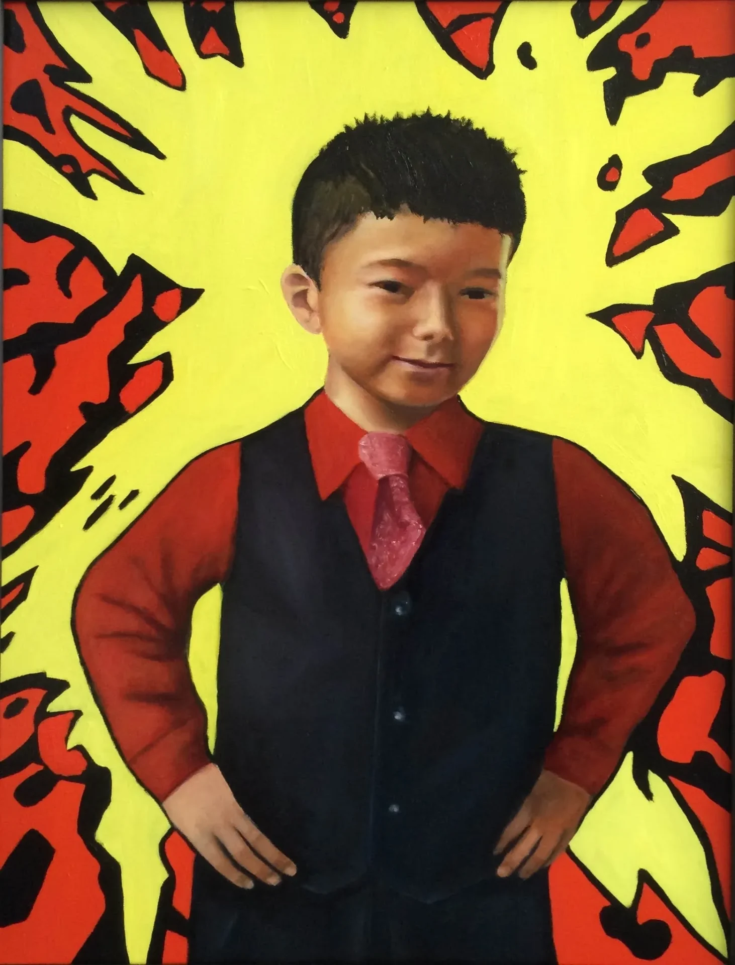 A young boy in a red shirt and black vest.