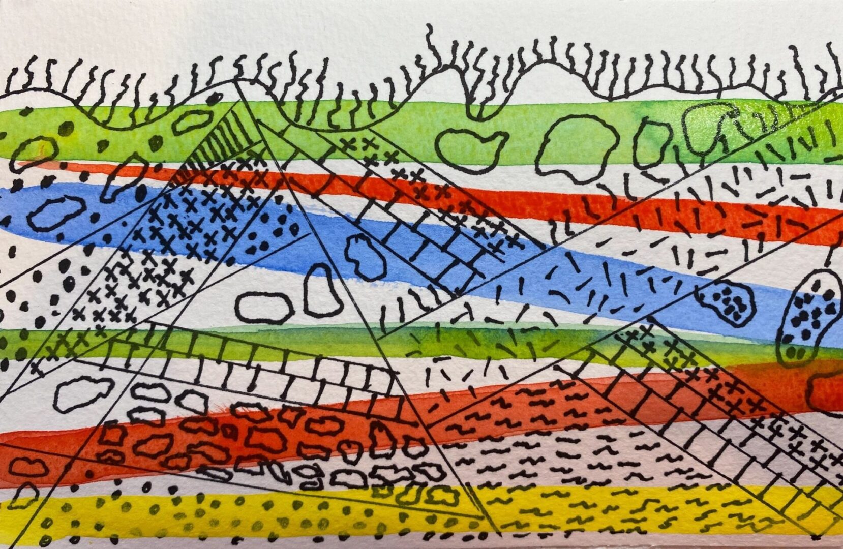 A drawing of various colors and lines on paper.